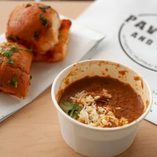 a bowl of soup and a sandwich