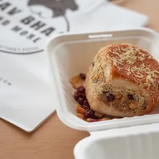 a pastry in a styrofoam container