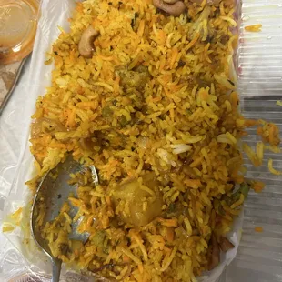 a tray of rice and vegetables