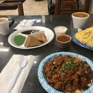 Chicken 65 (front), Biryani (back right) &amp; samosa
