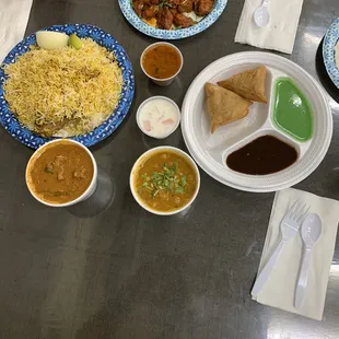 Chicken Bryani, Goat Curry, Chana Masala, Chicken 65, Raita and Somosas