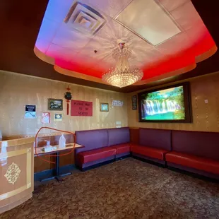 a man standing in front of a television