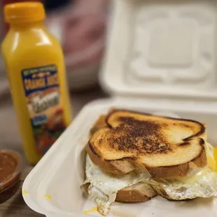grilled cheese sandwich with 2 eggs over medium