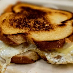 grilled cheese sandwich with 2 eggs over medium