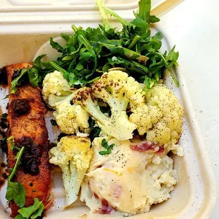 Salmon with cranberry, goat cheese mashed potatoes, roasted cauliflower, and asparagus salad. All very delicious for only $9!