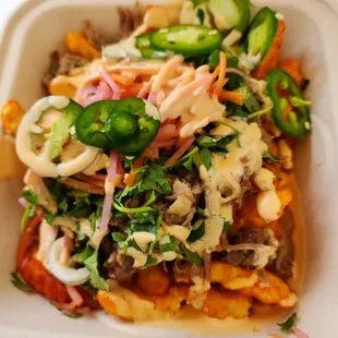 Loaded Sriracha fries with pork.