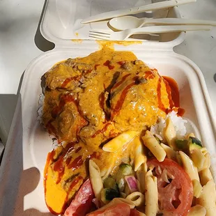 a plate of food with pasta and cheese