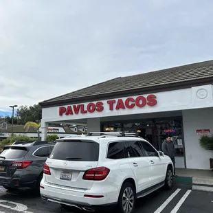 a car parked in front of a restaurant