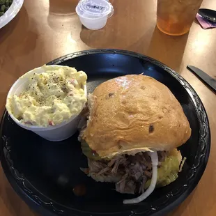 Pulled Pork Sandwich on a jalapeño cheese hoagie with mustard potato salad