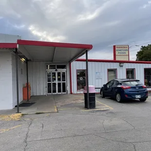 a car parked in front of the store