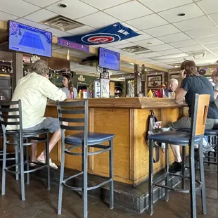 customers sitting at the bar