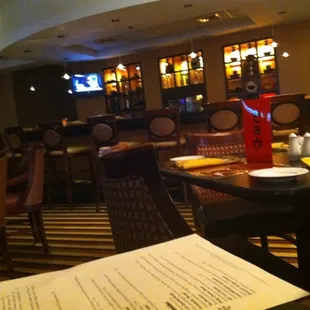 a restaurant with tables and chairs and a menu