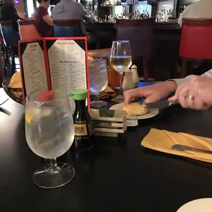 a woman sitting at a table in a restaurant
