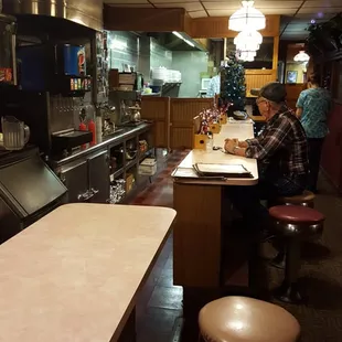 a woman sitting at a counter
