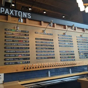 a beer selection on the wall