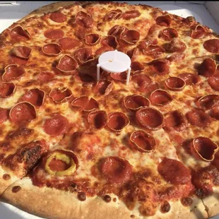 Pepperoni and cheese pie cut...one free banana pepper lol