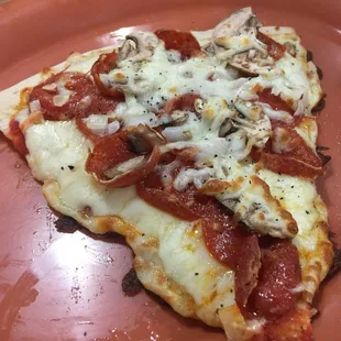 Yes they sell pizza by the slice here and it&apos;s very, very good!!  Pepperoni, mushroom, onion and extra cheese....