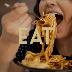 a woman eating spaghetti