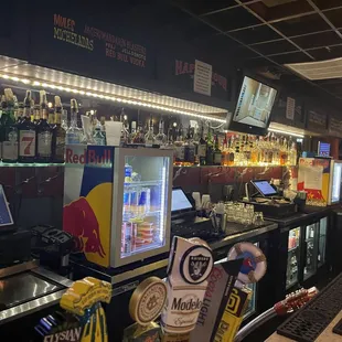 a bar with a variety of drinks