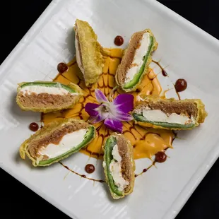 a plate of food on a black table