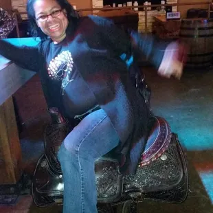 a woman sitting on a saddle