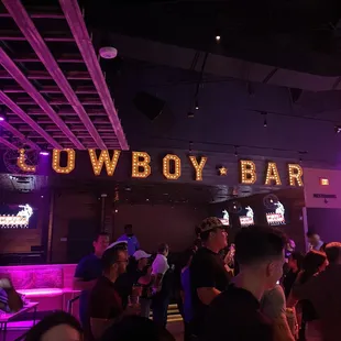 a crowd of people at a bar