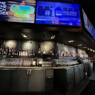 a bar with a large screen