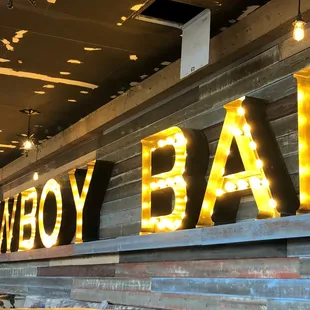  the sign for the bar