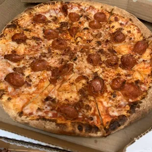 a pepperoni pizza in a box