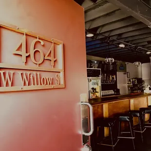 a bar with stools in front of it