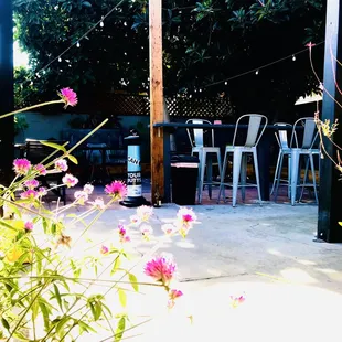 a patio with chairs and tables