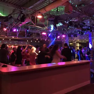 a group of people dancing at a party