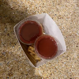 two sauces and pretzels