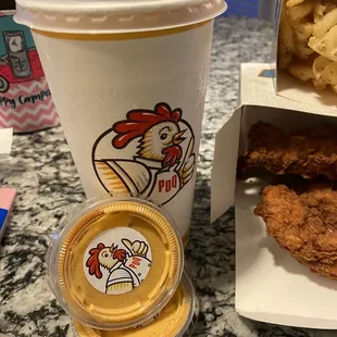 a chicken sandwich and a cup of coffee