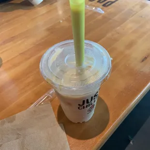 a plastic cup with a drink in it