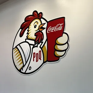 a chicken holding a menu