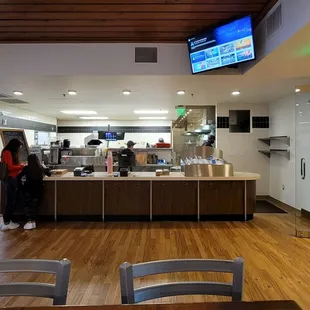 two people standing at the counter
