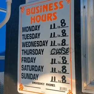 a business hours sign