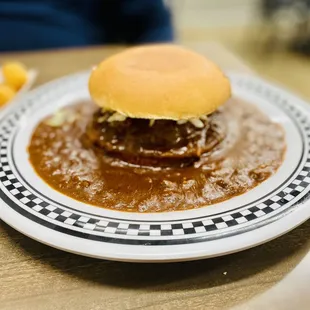 Floating Cheeseburger in house made chili with slaw &amp; tator tots GET IT! :)...