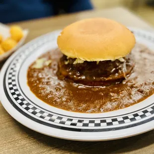 the floating burger comes with your choice of cheese, slaw, fries or tots...