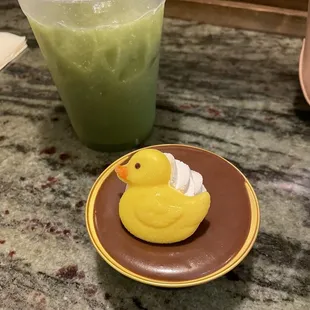 a yellow rubber duck on a plate