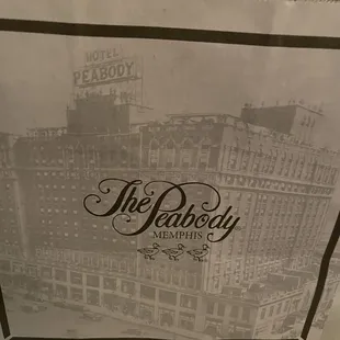 a paper bag with the logo of the peabody deli