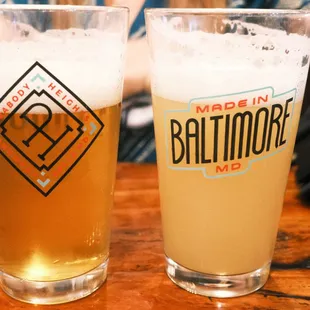 two glasses of beer on a table