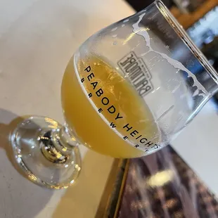 a glass of beer on a table