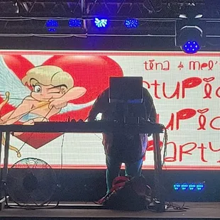 a man on stage with a microphone