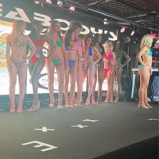 a line of women in bikinis