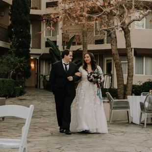 My groom and I walking together after Cassidy saved the day for our big ceremony (I forgot this was non-traditional, but it was amazing)