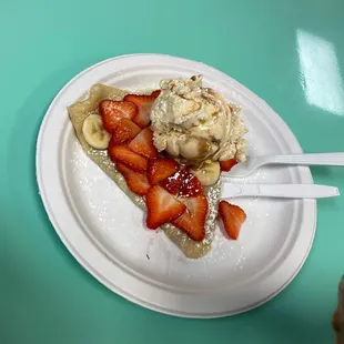 a slice of pie with strawberries and bananas