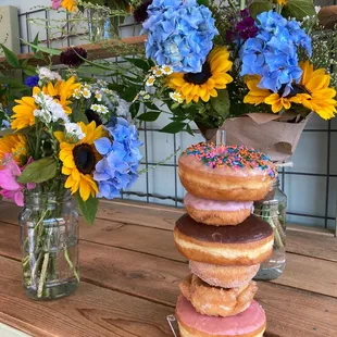 a stack of donuts with sprinkles