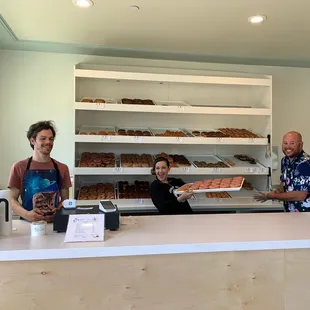 two people behind a counter